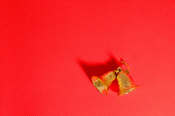 Christmas bells on a red background with copy space