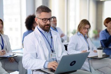 Group of doctors on conference, medical team sitting and listening speaker. Medical experts...