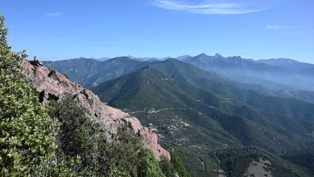 Mountains by the coast of Corsica on a misty morning from mount Senino