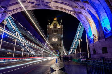 A night time, long exposure shot on Tower Bridge with pedestrian, tourists visiting this iconic...
