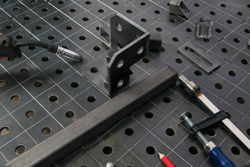 a tool for fixing a metal structure during welding, side view