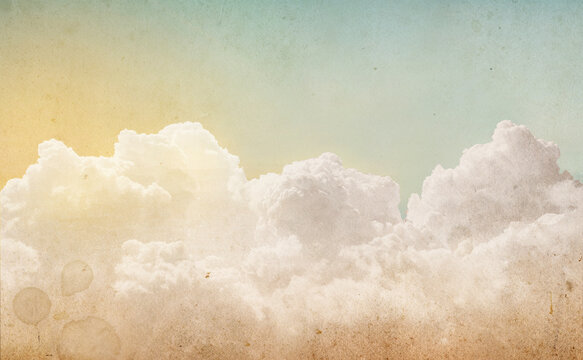 Sky with clouds vintage background. Overlay effect on old paper texture. Old, ancient background for design. Retro style.