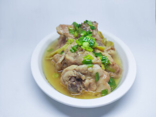 Steamed chicken meat with ginger served on plate isolated on white background