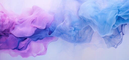 Obraz premium A group of vividly colored blue, purple, and pink dyes suspended in mid-air, creating a visually striking and dynamic display.