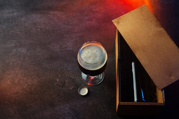 A gift beer bottle in a wooden box. A Father's Day gift. Craft Dark Beer Bottle