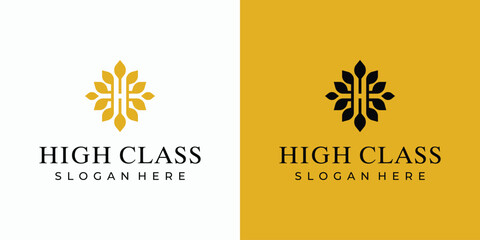 Vector logo design for the initials of the letter H with luxurious leaf accents around it.