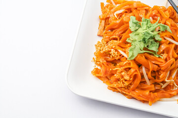 Pad Thai on a dish isolated on a white background. Top view. Thai foods famous.