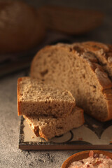 Fototapeta na wymiar A loaf of rye bread in low key