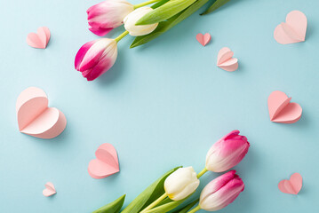 Fototapeta na wymiar Radiant tulip love! Capture the essence of Woman's Day with a top view photo of vibrant tulips and heart details on a pastel blue background. Customize with your own text or advert for a special touch