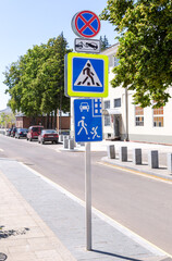 Different road signs on the city street - 723056985
