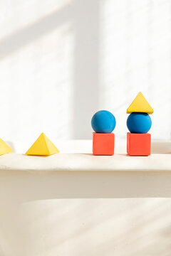 Toy blocks lying on bathtub rim