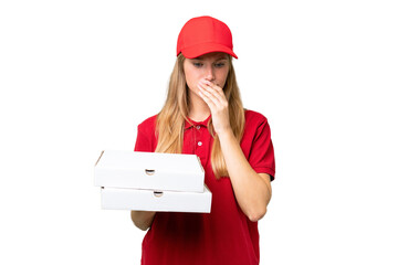 Young caucasian pizza delivery woman with work uniform picking up pizza boxes over isolated...
