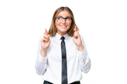 Young business caucasian woman over isolated background with fingers crossing