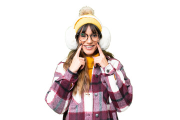 Young caucasian woman wearing winter muffs over isolated chroma key background smiling with a happy and pleasant expression