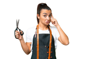 Seamstress woman over isolated chroma key background thinking an idea