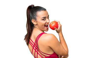 Young beauty woman over isolated chroma key background eating an apple