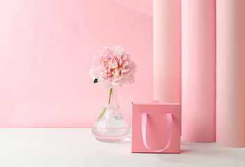 Abstract floral arrangement, fresh peony flowers and gift box. Card for congratulations on Mother's Day, wedding, Women's Day. Minimal modern aesthetics. elegant beauty concept,