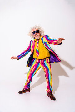 Happy man wearing sunglasses having fun against white background