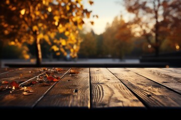 Naklejka na ściany i meble Wood floor or plank table with blurred autumn park background, walking someone. Empty space for text or presentation product