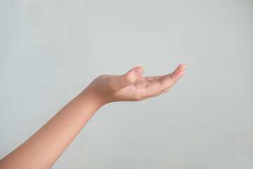 Image of Girl hand with an open palm and fingers on gray background
