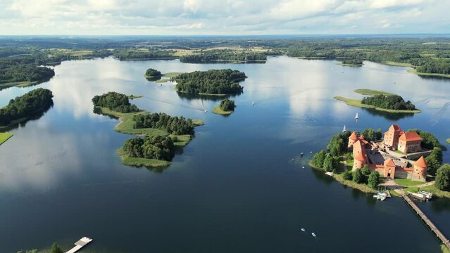 Lake Island Castle Of Trakai, Lithuania, Aerial Flight Around. Trakai,Lithuania.beautiful Aerial 4K Video From Drone To Trakai Castle. Red Brick Medieval Castle On Island In Trakai