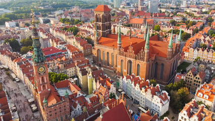 Aerial top view Historical Old City of Gdansk ,and Motlawa river, Poland at sunset. Also known as Danzig and the city of amber.St. Mary's Basilica- view of the old town- Gdansk, Poland. - obrazy, fototapety, plakaty