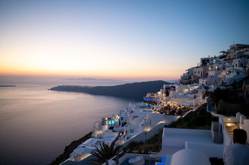 View of Imerovigli village in Santorini at sunset with city lights