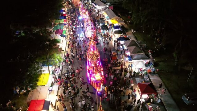 Chak Phra Festival (Pulling the Buddha) in Southern Thailand.  Chak Phra takes place in the eleventh lunar month of the traditional (in Thai lunar calendar).