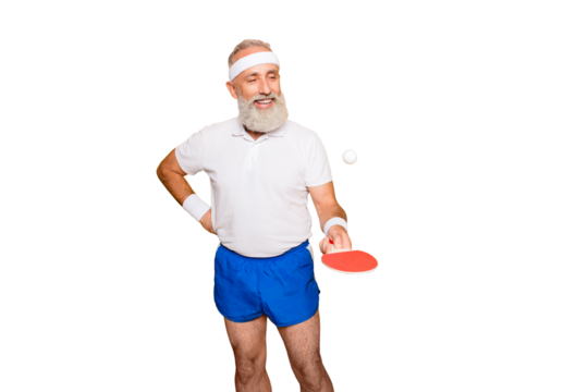 Competetive emotional cool active comic grandpa with beaming grin, with table tennis equipment. Healthcare, weight loss, bodycare lifestyle, wearing blue sexy shorts, so hot!