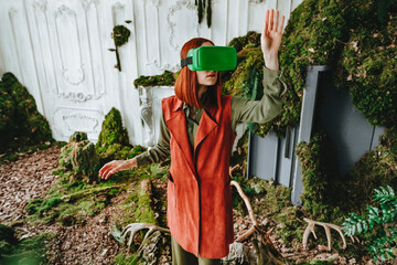 Redhead woman gesturing with virtual reality simulator