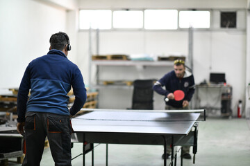 Fototapeta na wymiar industry workers table tennis game and relaxing in their free time