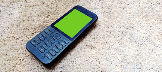 Old cell phone with green screen