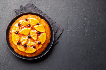 Sweet cake with orange slices and berries