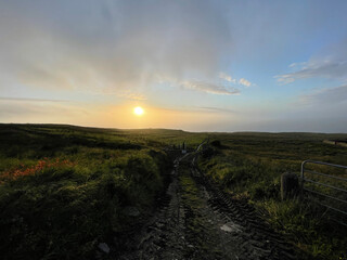 Fototapeta na wymiar Sunset scenery in the beautiful Burren National Park near Doolin and Cliffs of Moher in County Clare - Ireland