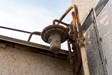 a gas pipe meter and the gas regulator in a winter countries mechanism, outdoor gas pipe in a rusted situation