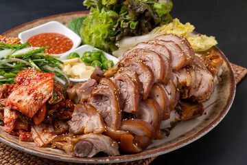 Steamed pork feet, jokbal, spicy pork feet, sea snail, seasoned spicy fish, tray noodles, Korean food, traditional food, pork