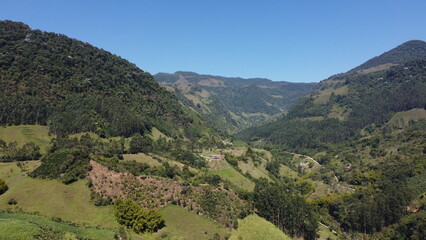 Valley of mountains full of nature, beautiful trees and plants, blue sky, Colombia, Antioquia, Latin