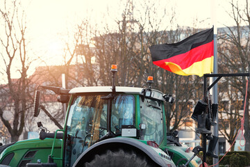 Farmers union protest strike against government Policy in Germany Europe. Tractors vehicles blocks city road traffic. Agriculture farm machines Magdeburg central Domplatz square