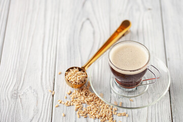 Fototapeta premium Cup with coffee barley with barley grains. Healthy herbal drink for immunity. Coffee alternatives