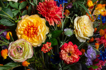 close up of colored silk flowers