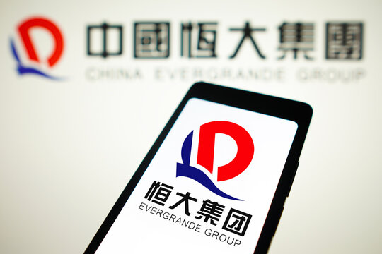 January 29, 2024, Brazil. In this photo illustration, the Evergrande Real Estate Group logo is displayed on a smartphone screen and in the background.