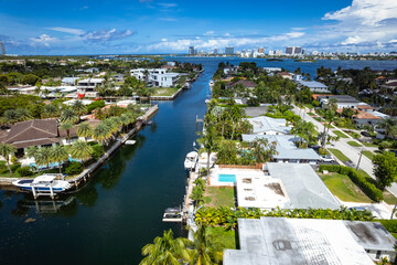North Miami, Florida, USA - Aug 12, 2023: Aerial view of luxurious houses along a canal in Keystone...