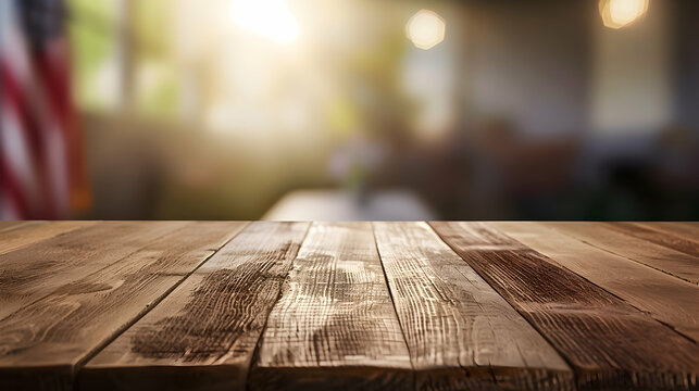 Wooden table top with a blurry American flag in the background.