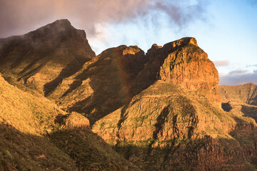 Mountains of Masca Valley at golden hour with a rainbow. Tenerife, Canary Islands, Spain. - 723195533