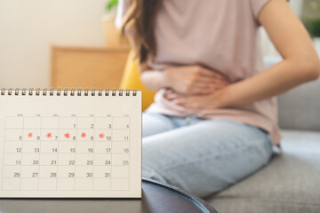 Menstruation, period cycle day of monthly, hurt asian young woman, female hand in stomach ache,...