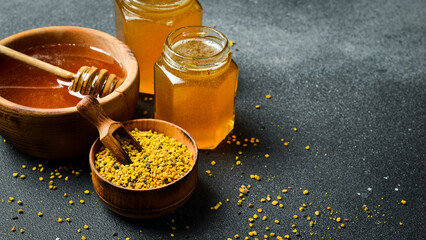 Flower bee pollen in a wooden bowl. Beekeeping products. Top view.