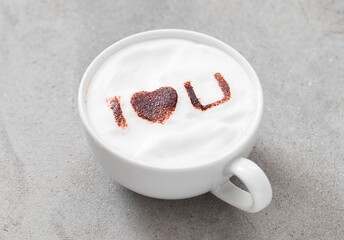 Holiday drink. Cappuccino with the inscription cocoa on the milk foam 