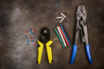 Electricians tool, pressing pliers, tin-plated sleeves, ferrules and heat-shrinkable tubes for wires