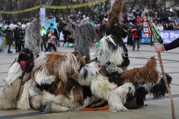 Pernik, Bulgaria - January 27, 2024: The 30th International masquerade festival Surva in Pernik, Bulgaria. People with mask called Kukeri dance and perform to scare the evil spirits.