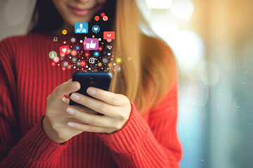 Young woman using smart phone with icons of social med